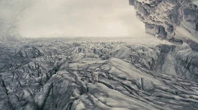 A scene depicting Dr. Mann and Cooper on the planet.