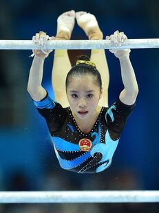 Yao in the uneven bars final at the 2014 Asian Games