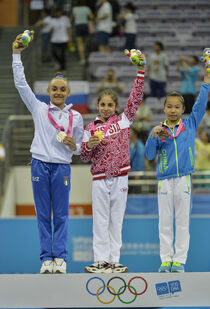 Wang (right) with her Youth Olympic Uneven Bars bronze medal