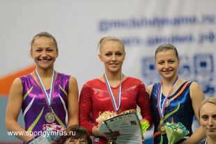 Pavlova (right) with her Voronin Cup uneven bars bronze medal