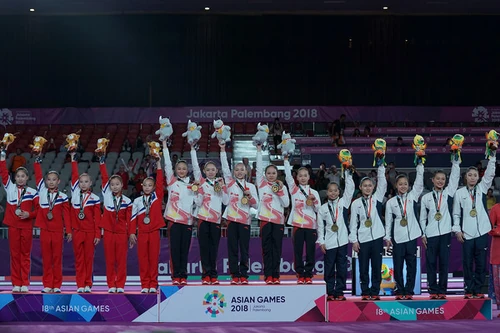 Team Medalists (from left): North Korea, China, Japan
