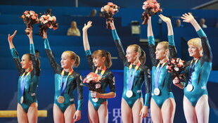 Afanasyeva (second from right) with her team and World Team silver medal