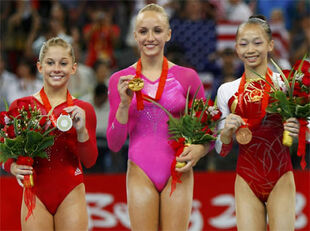 Johnson (left) with her Olympic All-Around silver medal