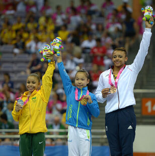 Wang (center) with her Youth Olympic Balance Beam gold medal