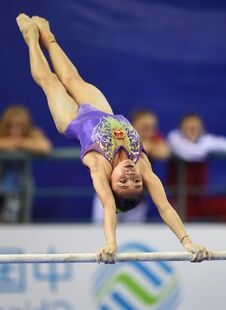 Huang Huidan (CHN) in the uneven bars final