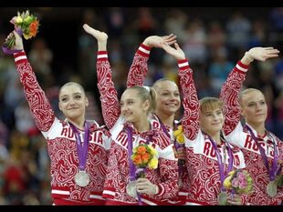 Afanasyeva (far right) with her team and Olympic Team silver medal