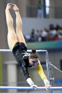 Mustafina in uneven bars final at the 2014 World Championships