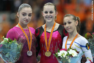 Mustafina (left) with her World Floor Exercise silver medal