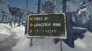 The faded sign in Transfer Pass leading motorists to the Mountain Pass tunnel