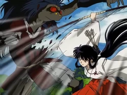 Kikyō attacking with the base of her bow.