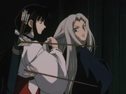 Kikyō grabs Tsubaki by the hair