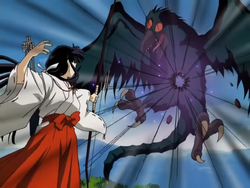 Kikyō defeating a demon with a single arrow.