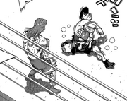 Takamura down after dodging and throwing a punch