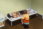 Kumi watching over Ryo after Ippo defeated him