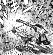 Mashiba knocking Sawamura out of the ring