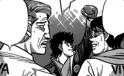Yanaoka and the Naniwa coach with Sendō during his match against Alfredo
