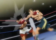 Sanada hitting Ippo with a right hook