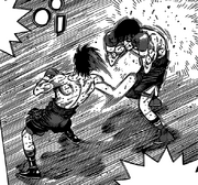 Sendō landing a right Smash on Alfredo's solar plexus