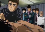 Sanada checking on Ippo after their match