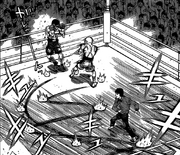 Kimura trapping Junpei to the ropes