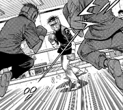 Miyata facing two boxers in a spar