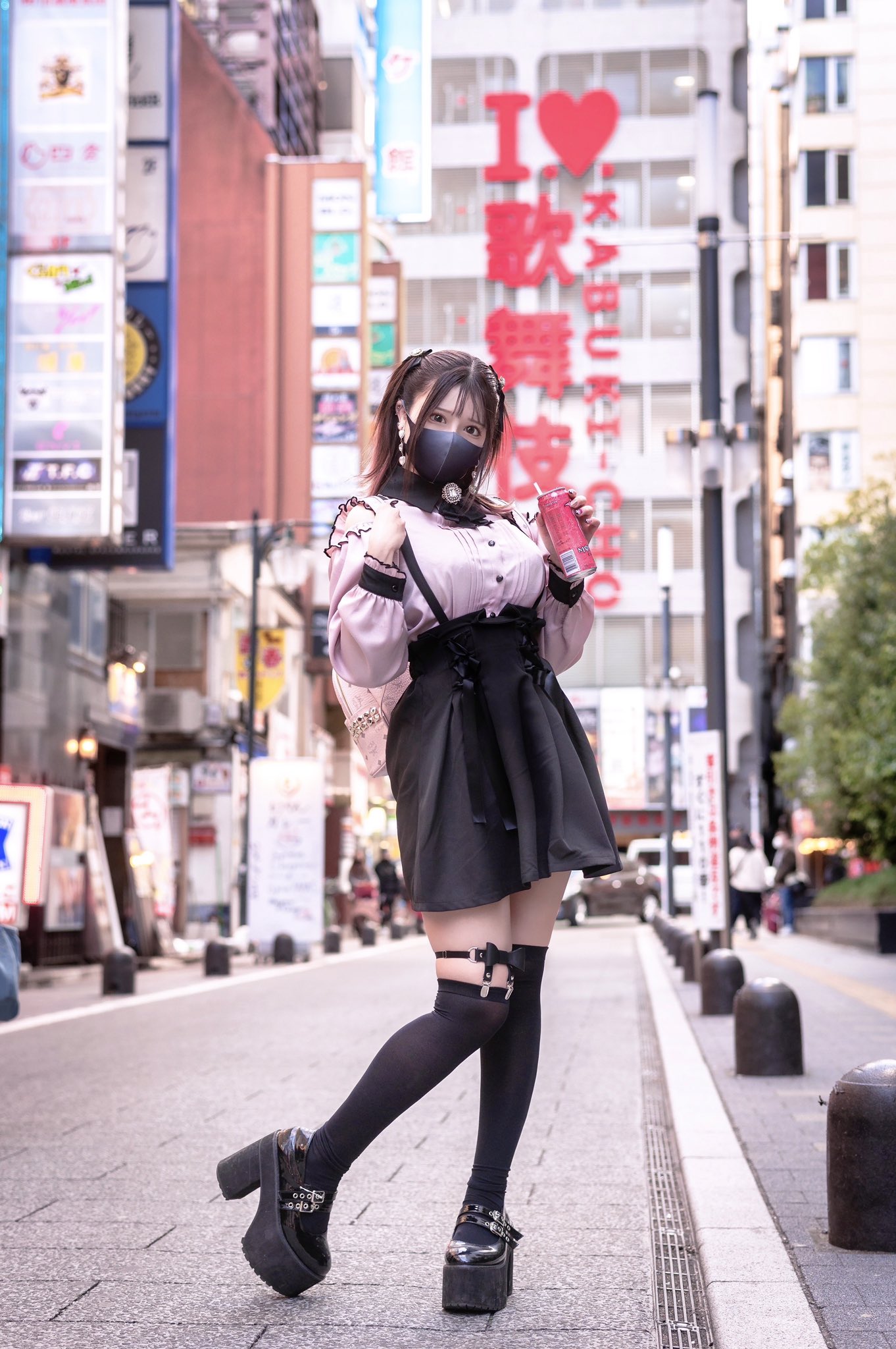 Cute kid girl 1-2 year old wearing stylish clothes over city