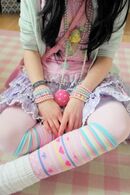 Pink-Lolita-Shirt-Mint-Cardigan-Layered-Lavender-Skirt-Multiple-Print-Socks-with-Rainbow-Layering-and-Pearl-Wrist-Bands-and-Necklaces-768x1152