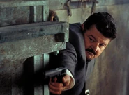 Zukovsky shooting a M1911 at his caviar factory