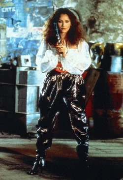 Photo of Fatima Blush (Barbara Carrera) posing with the Model 29.