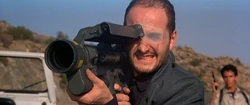Perez with the Stinger launcher, ready to shoot at Bond's tanker.