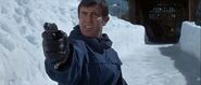 Bond taking aim at a fleeing Blofeld on the nearby bobsled run.