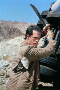 FranzSanchezSwingingHisMachete