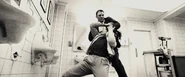 Bond strangles Fisher before dragging him to the sink.