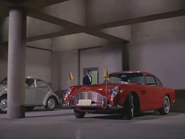 A red Aston Martin DB5 as seen in the Mission: Impossible (1966) TV series
