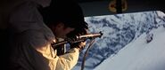 One of Draco's men opening fire at Piz Gloria