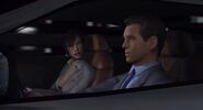 Bond and Kiko driving through Tokyo, en route to the Phoenix building