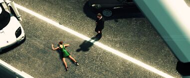 Nicole lies dead on the roadside.