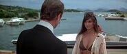 Naomi greets Bond at his hotel