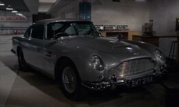 The DB5 parked in the Q-Branch lab in Goldfinger.