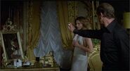 Bond uses Holly's Flame Thrower perfume