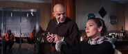 Blofeld attempting to win over Tracy in his office