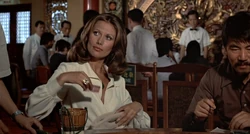 Miss Anders collects Scaramanga's gold bullets in Macau.