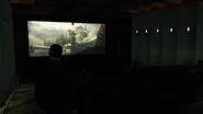 Auditorium playing Pomerov's promotional reel for attending press members.