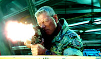 Quaritch fires an SMG
