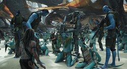 The Recoms threaten the villagers.