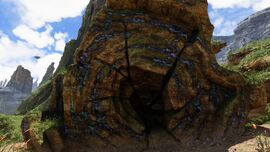 The interior structure of a petrified tree, displaying the blue luminescence of accumulated minerals.