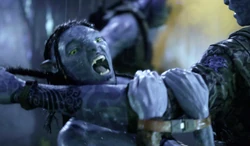 Lo'ak about to chomp Zhang's arm.