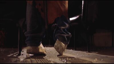 Immediately after Dante is ensnared in the Creeper's wings, we see only his feet and sneakers remain free to struggle hopelessly as the creature lifts Dante off the ground.