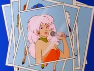 Jem with her star earrings as she performs.