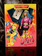 Second edition Aja with headband, shirt, belt, miniskirt, tights, earrings, shoes, darkish blue guitar, hair pick and cassette tape from Hasbro.
